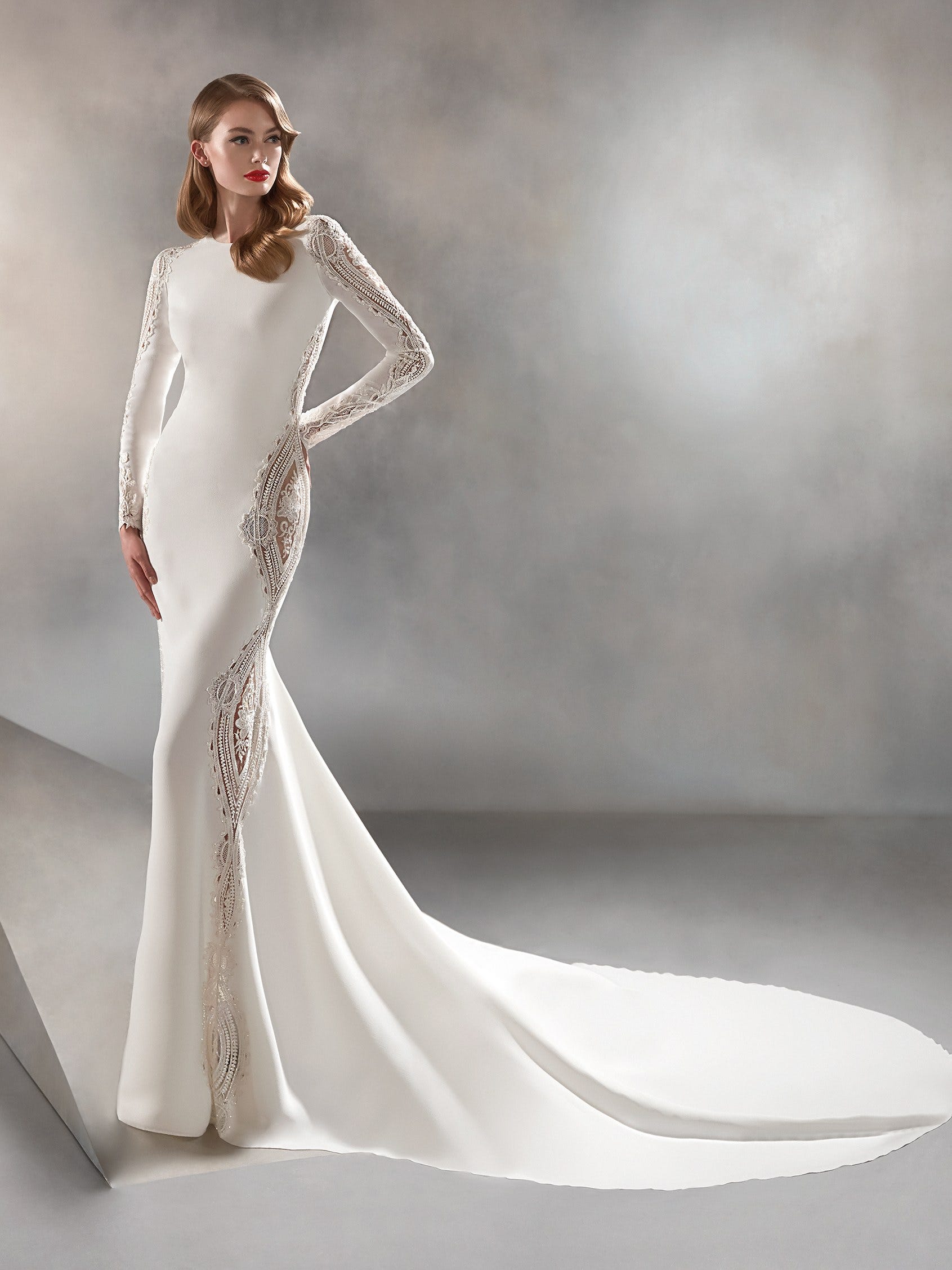 Mermaid wedding dress with bateau neckline and long sleeves Pronovias